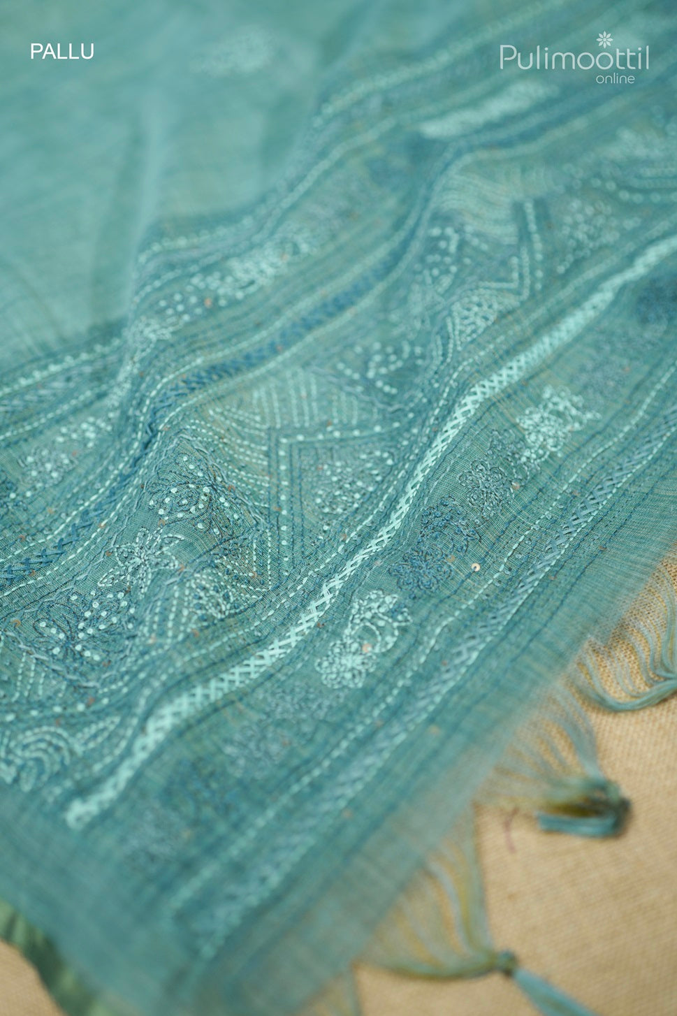 Light teal green-colored hand-embroidered semi linen saree