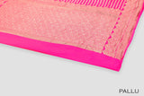 Rani pink color Banarasi saree.