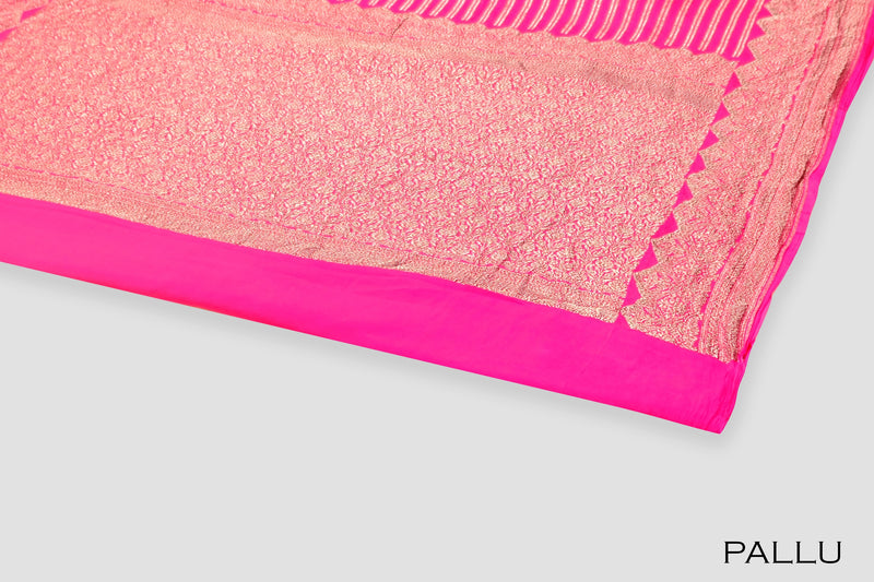 Rani pink color Banarasi saree.