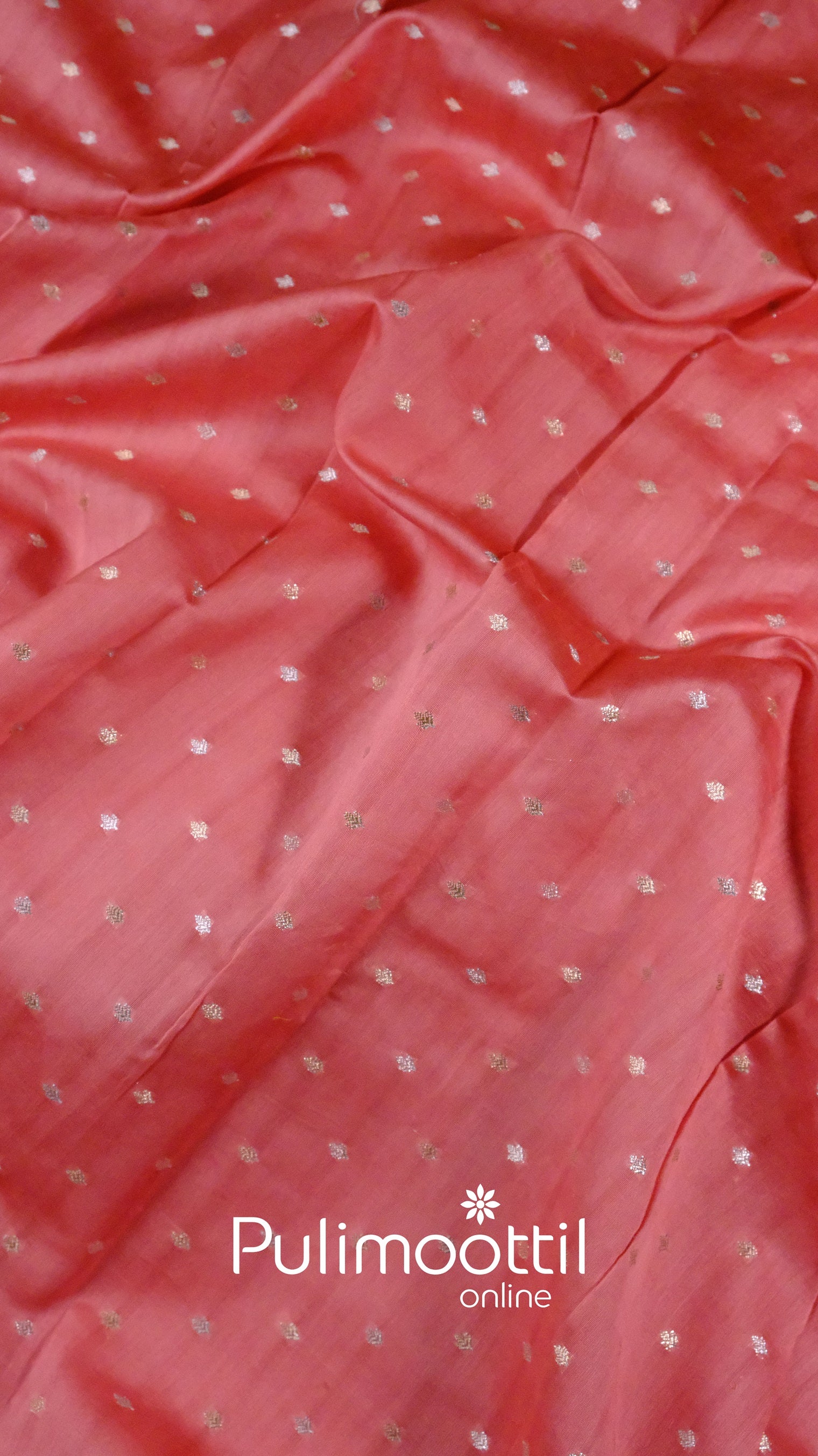 Peach wedding saree with fine gold zari dots and soft organza texture draped with subtle pleats