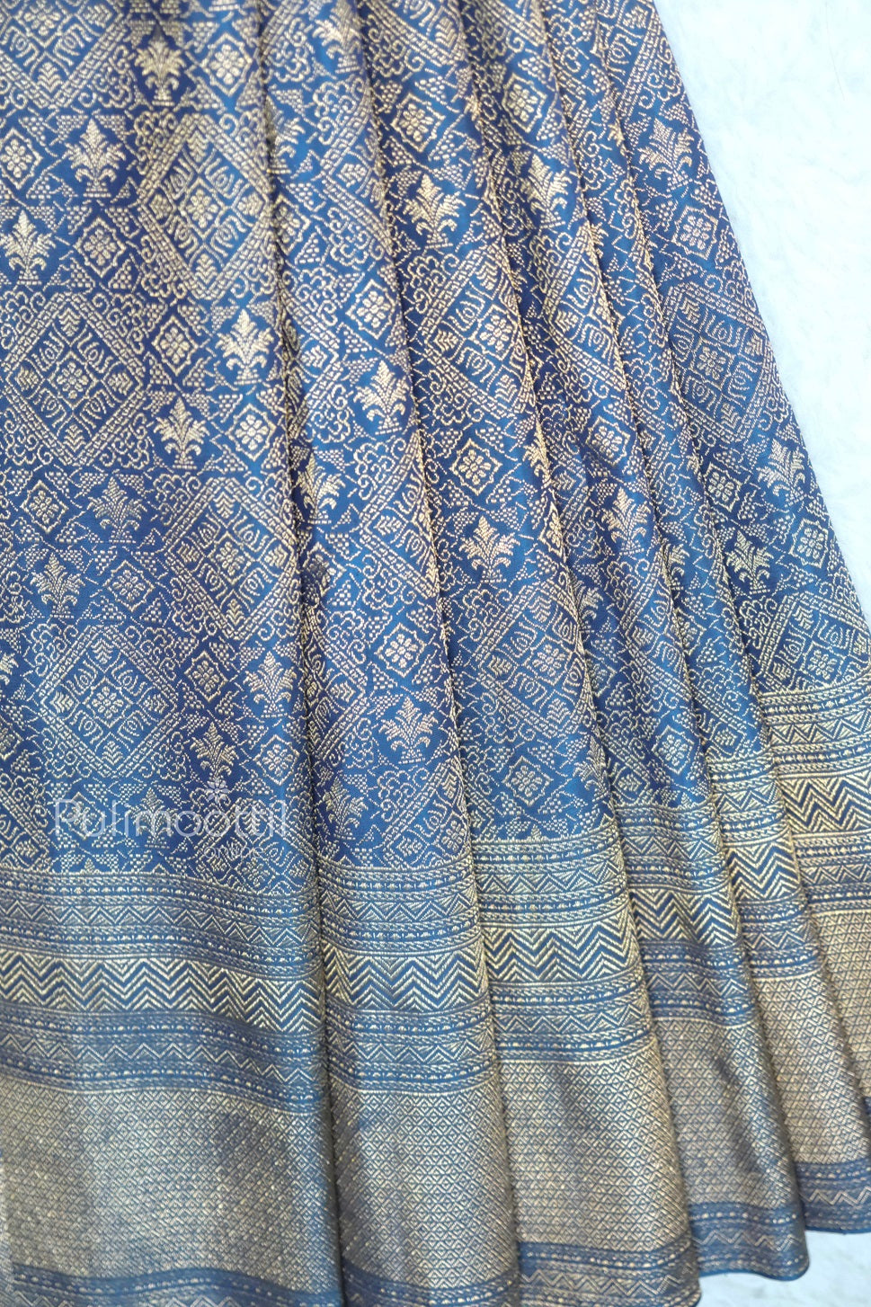 Front view of navy blue Banarasi silk saree with all-over golden zari motifs and detailed traditional border—ideal for bridal, wedding, or festive wear.
