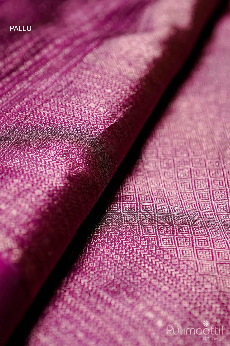 Deep purple wedding saree pallu featuring fine antique zari weave and rich texture.
