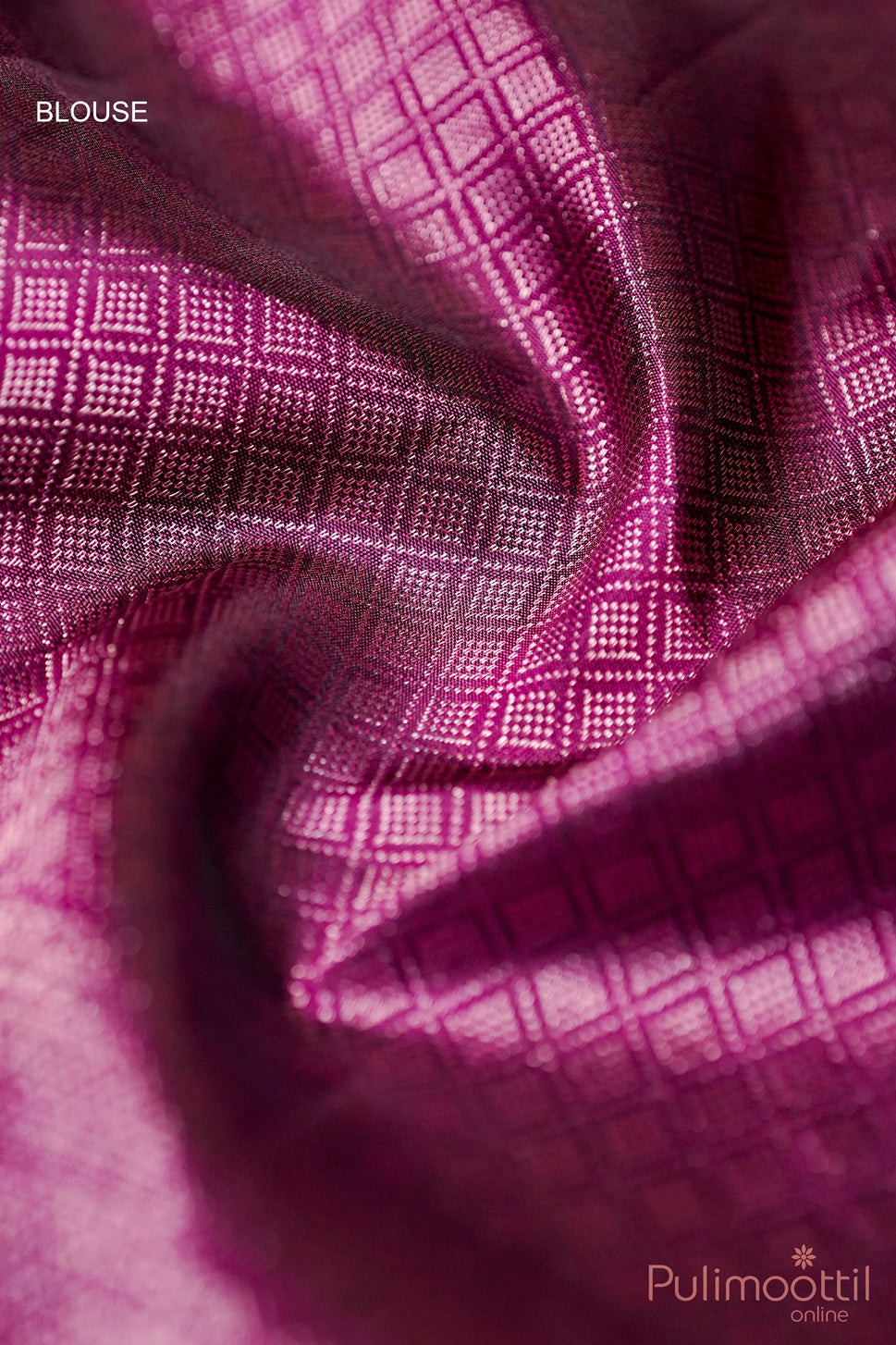 Close-up of purple blouse piece with antique gold brocade diamond pattern.