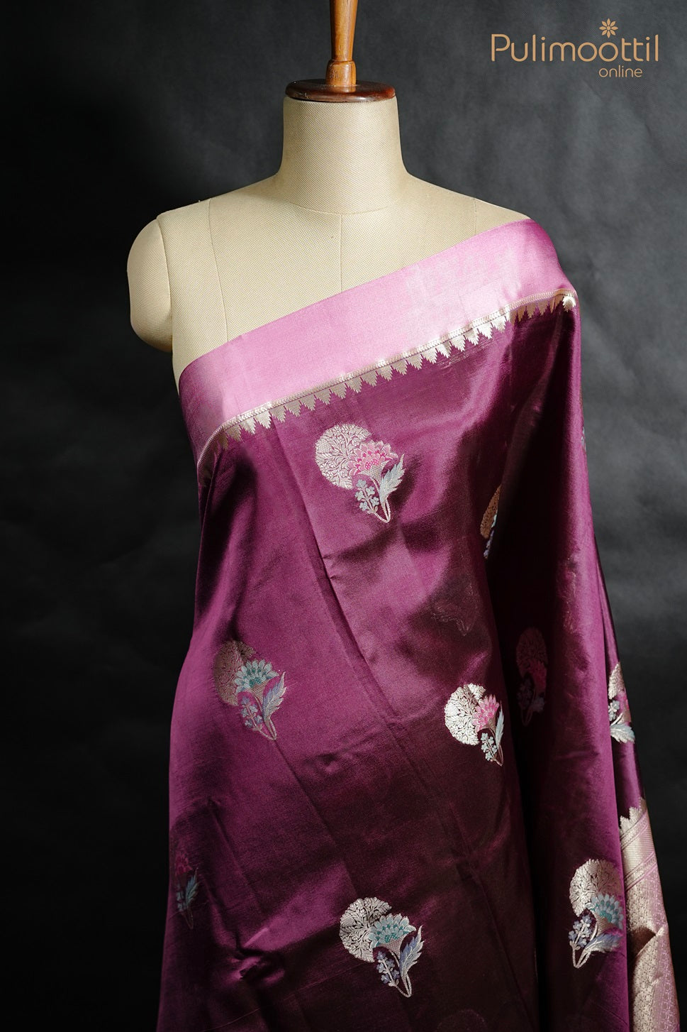 Purple mango silk saree with golden thread work motifs and satin border, displayed on mannequin.