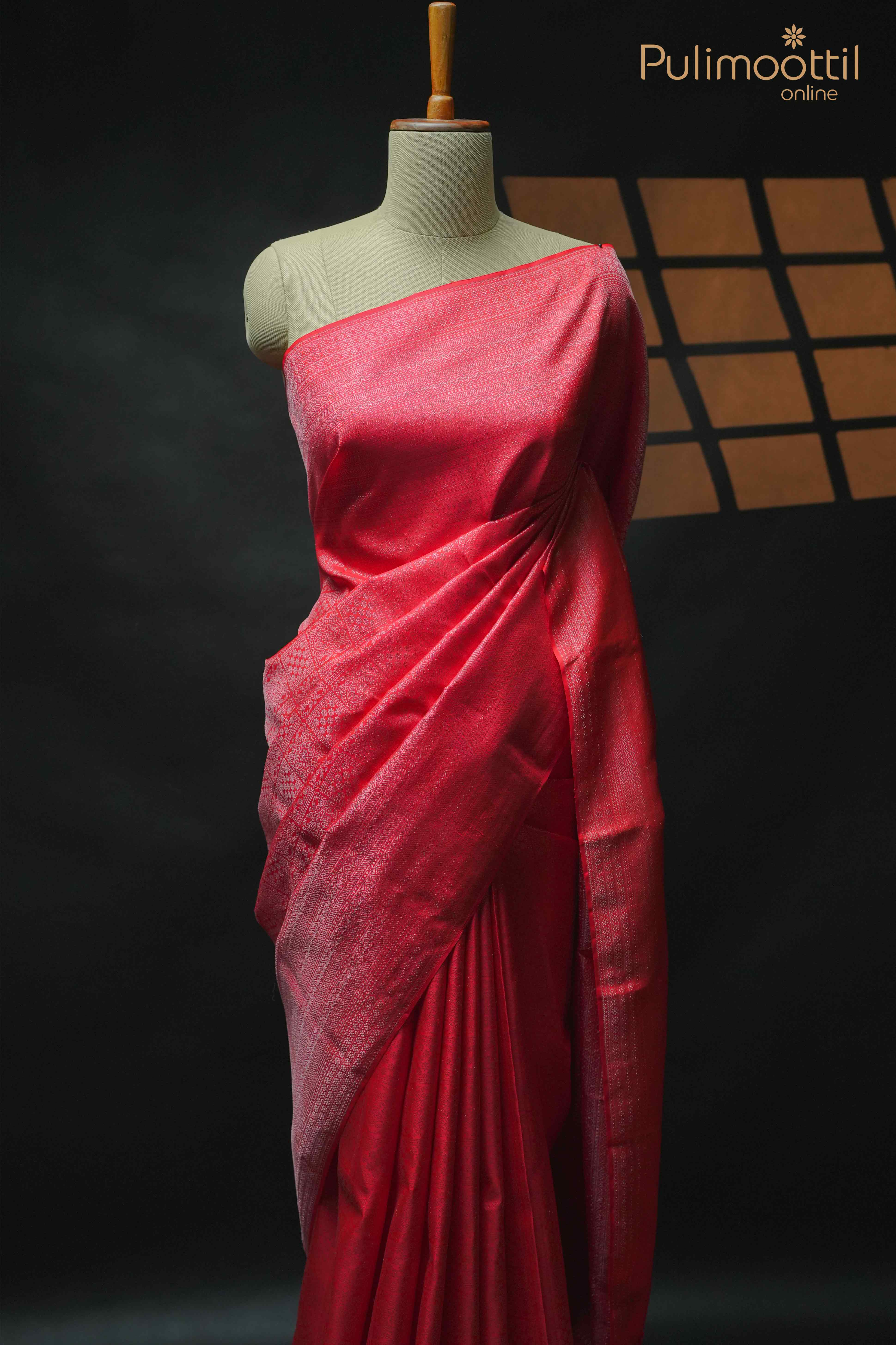Red Pure Kanchipuram Wedding Saree draped on mannequin, showcasing silver zari square brocade design and designer border.