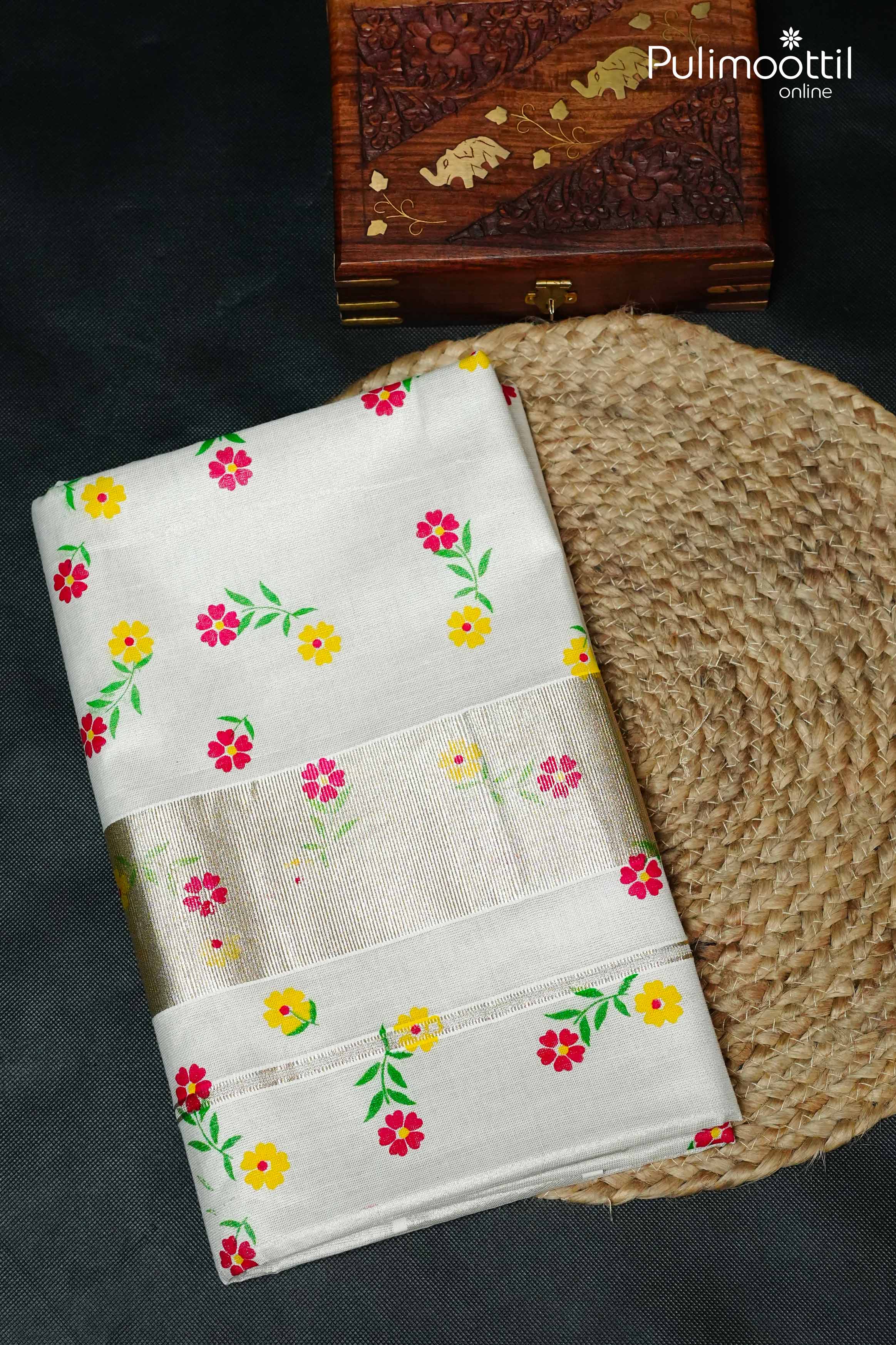 Silver Tissue Kerala set saree with floral printed body and silver zari border, neatly folded display