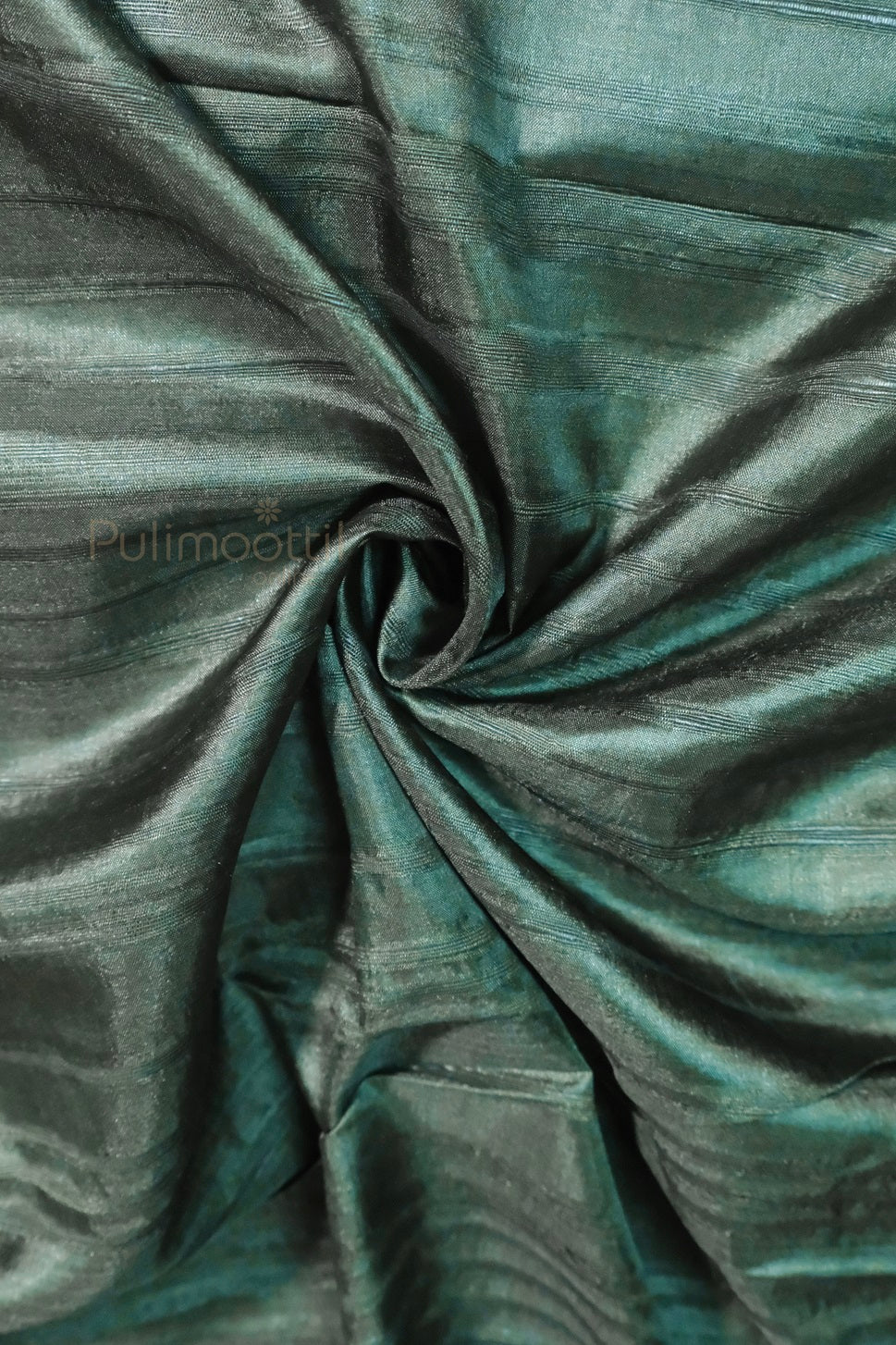 Deep green soft silk blouse piece with subtle horizontal stripes, showcasing smooth texture and shine, from Pulimoottil Online.