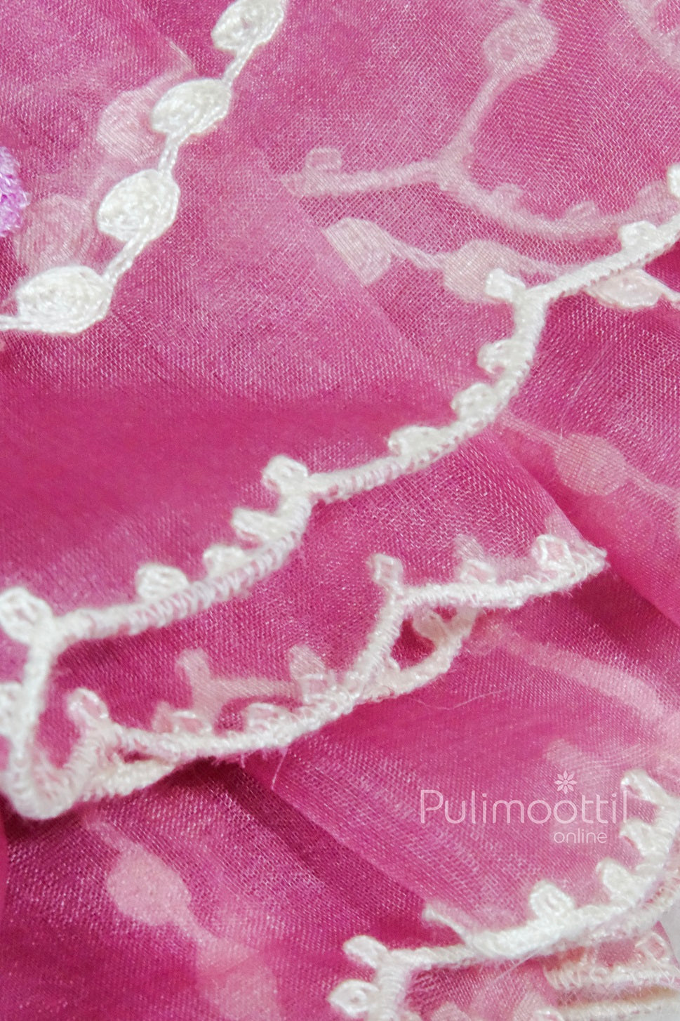 Vibrant fuchsia sheer fabric with white embroidered scalloped edge and dotted chain motifs, accented by pastel pink and lavender floral embroidery.