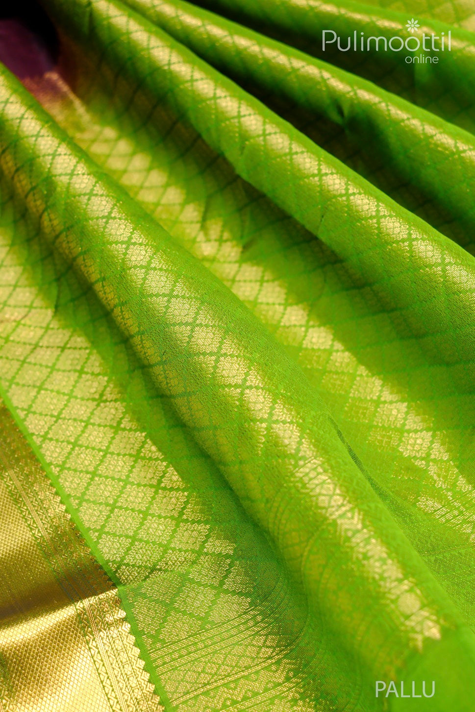Close-up view of the Pallu of a Wine Colour Pure Kanchipuram Silk Saree, featuring a golden zari diamond pattern and contrast green border, showcasing intricate weaving details.