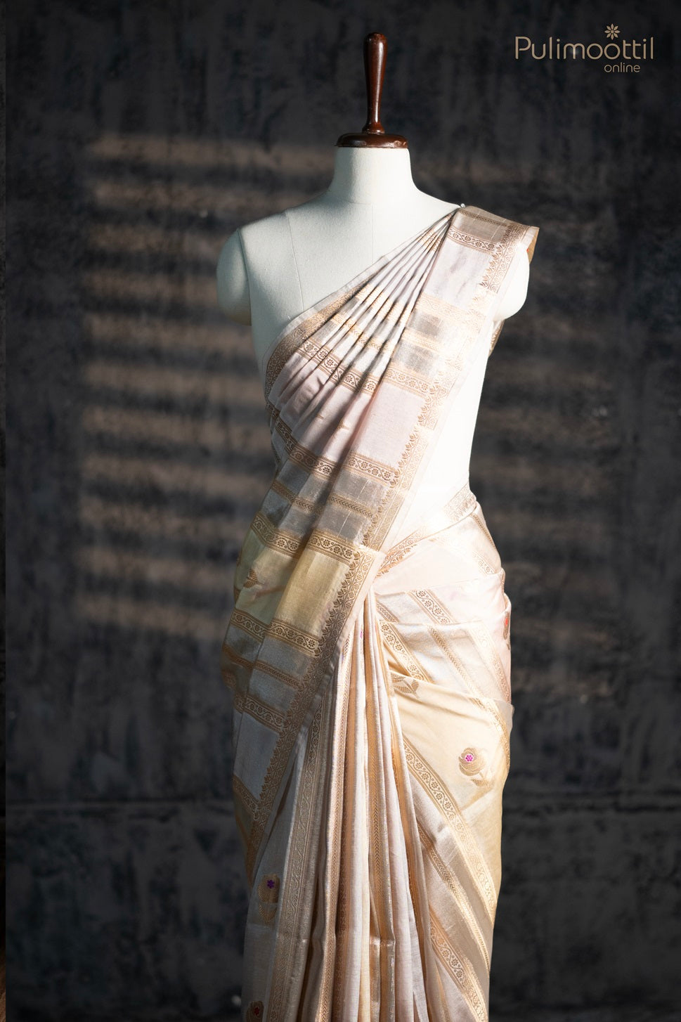 Bone cream colour organza saree.