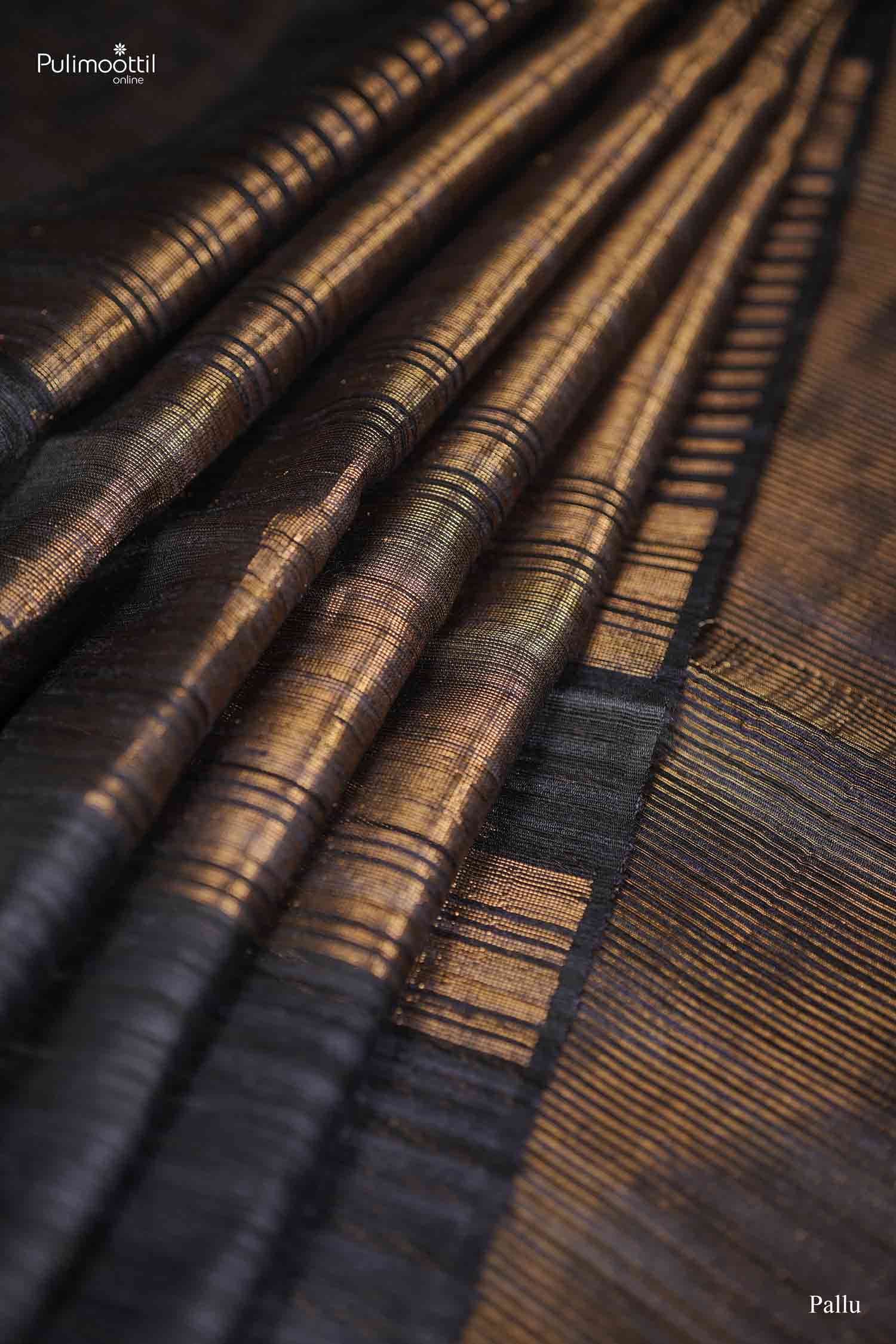 Close-up view of the Black Saree's matching Blouse fabric, showing the slub texture and gold woven lines