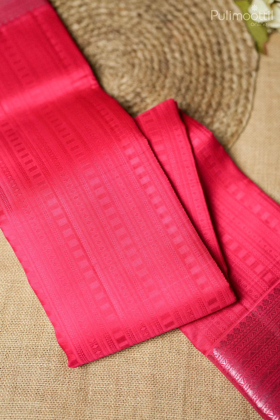 Rani pink-colored Kanchipuram self-print designer saree