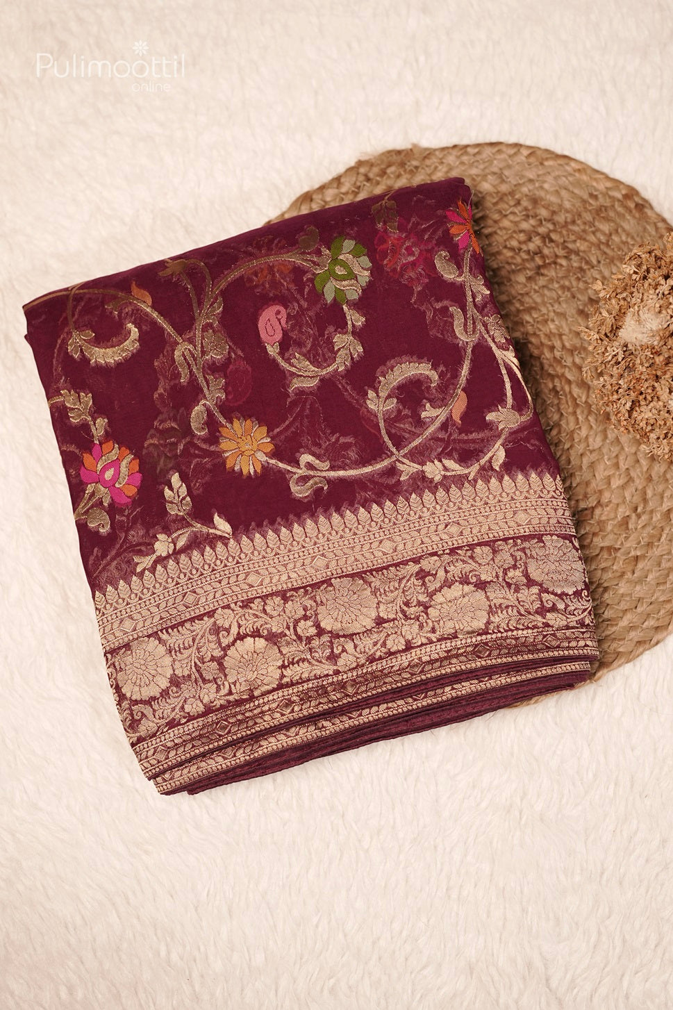 Folded Purple Banarasi Saree with Intricate Floral Embroidery and Golden Border