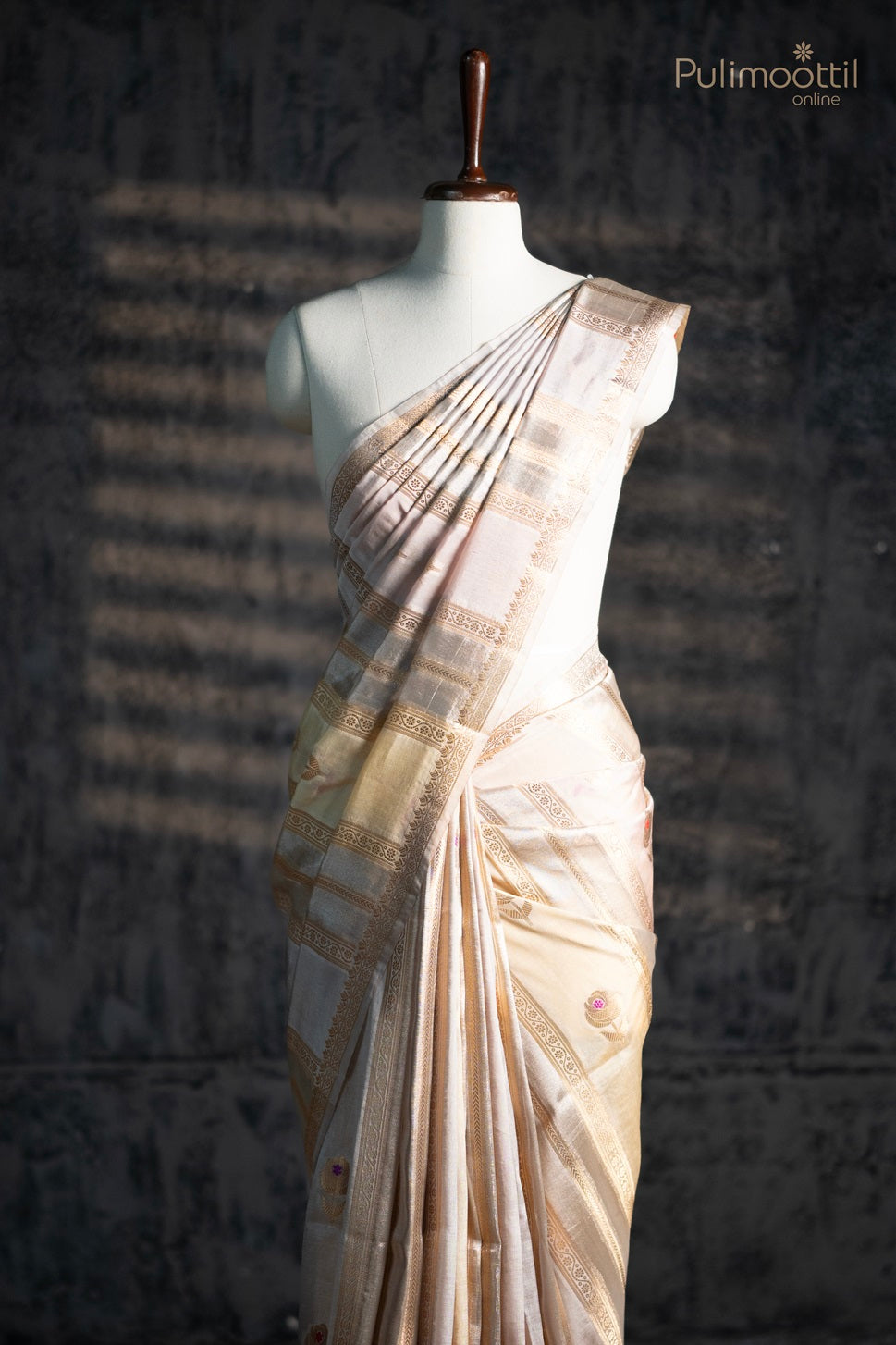 Bone cream colour organza saree.