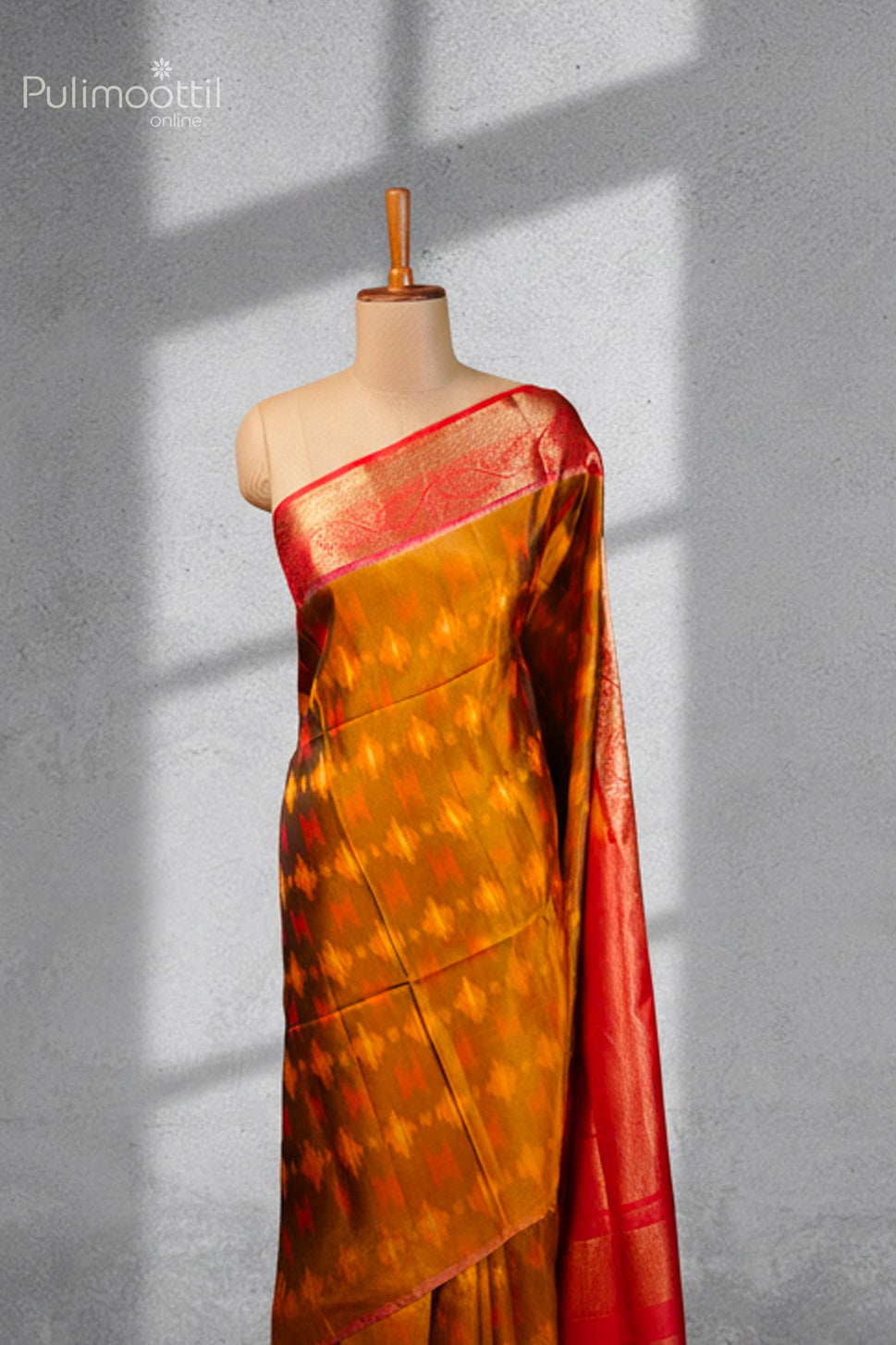 Golden Yellow Ekath Print Kanchipuram Soft Silk Saree draped on a mannequin, showcasing the contrast designer border.