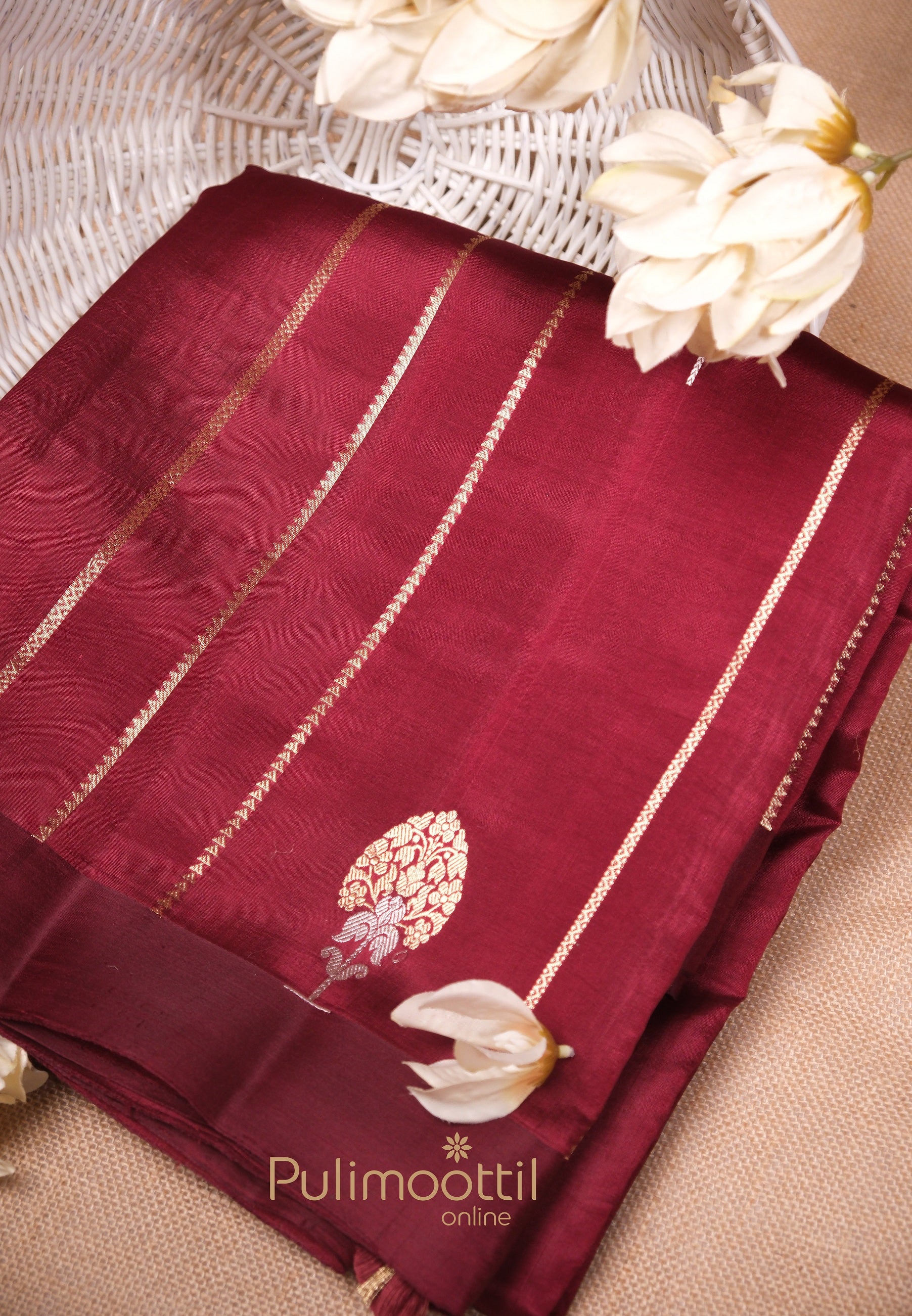 Maroon soft mango silk saree with golden zari stripes and elegant leaf motif – ideal for bridal collection and latest wedding sarees, available to buy online.