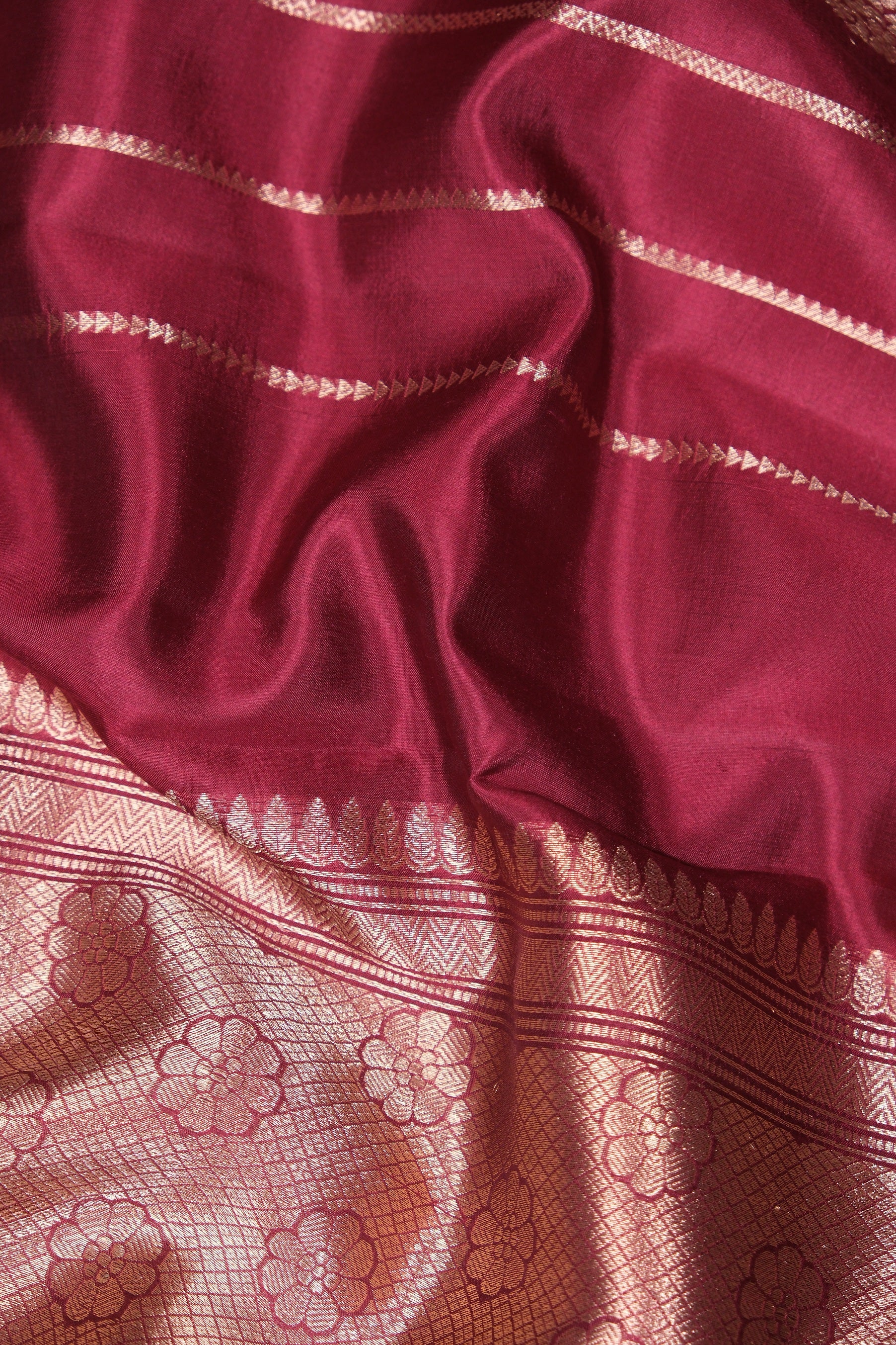 Maroon mango silk saree with golden butta motifs and zari border – latest wedding saree design available to buy online.