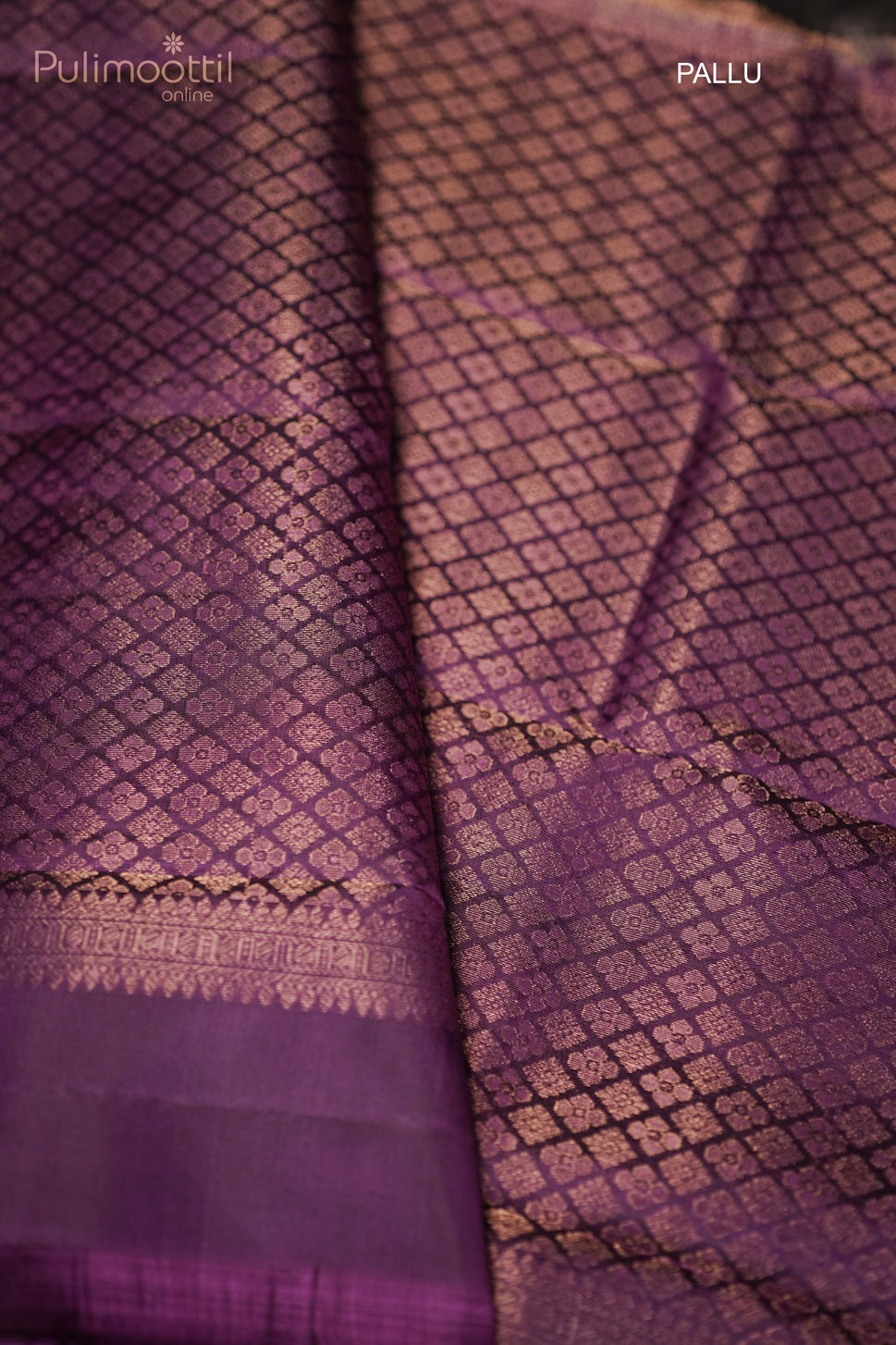 Designer pallu of the purple Kanchipuram soft silk saree with intricate golden floral motifs.
