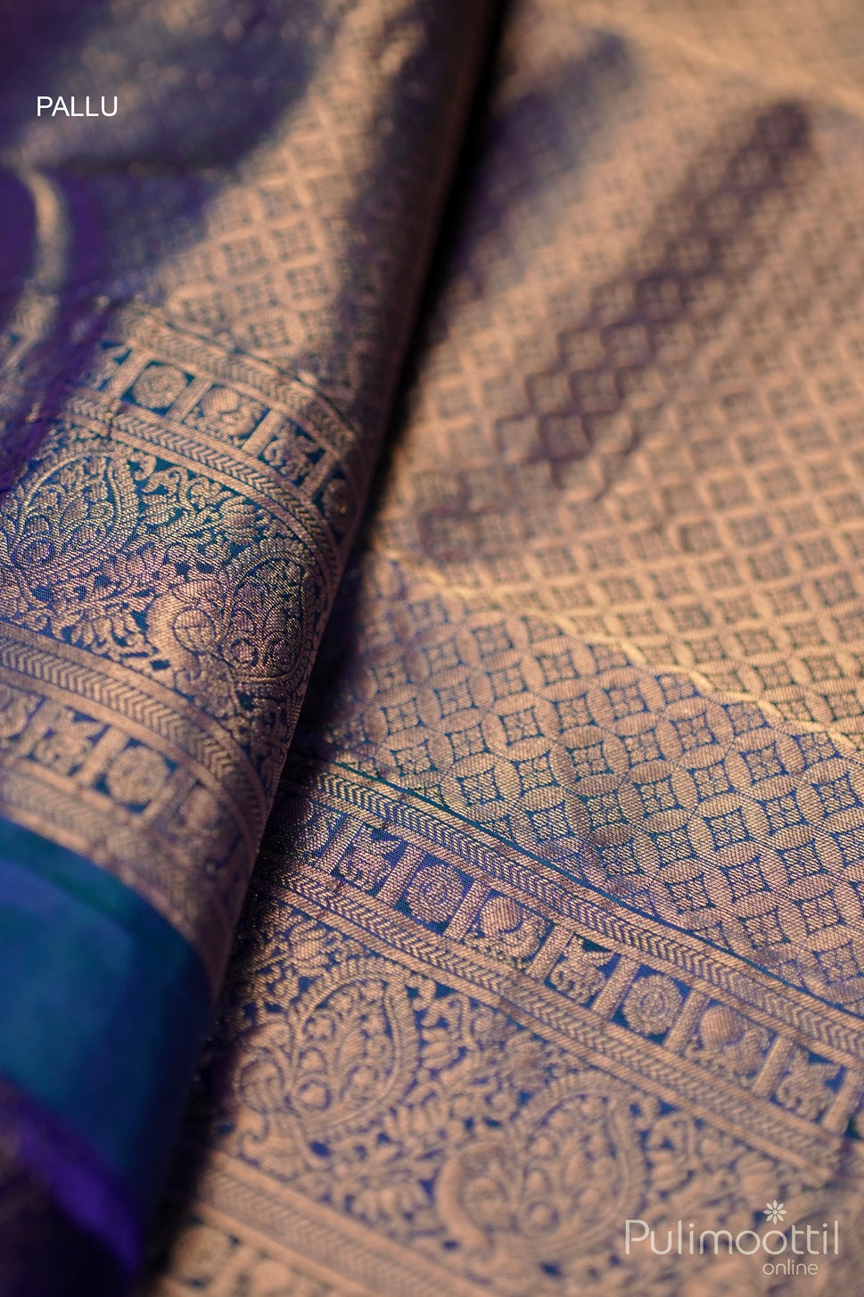 Designer golden zari pallu of peacock blue Kanchipuram soft silk saree with intricate patterns.