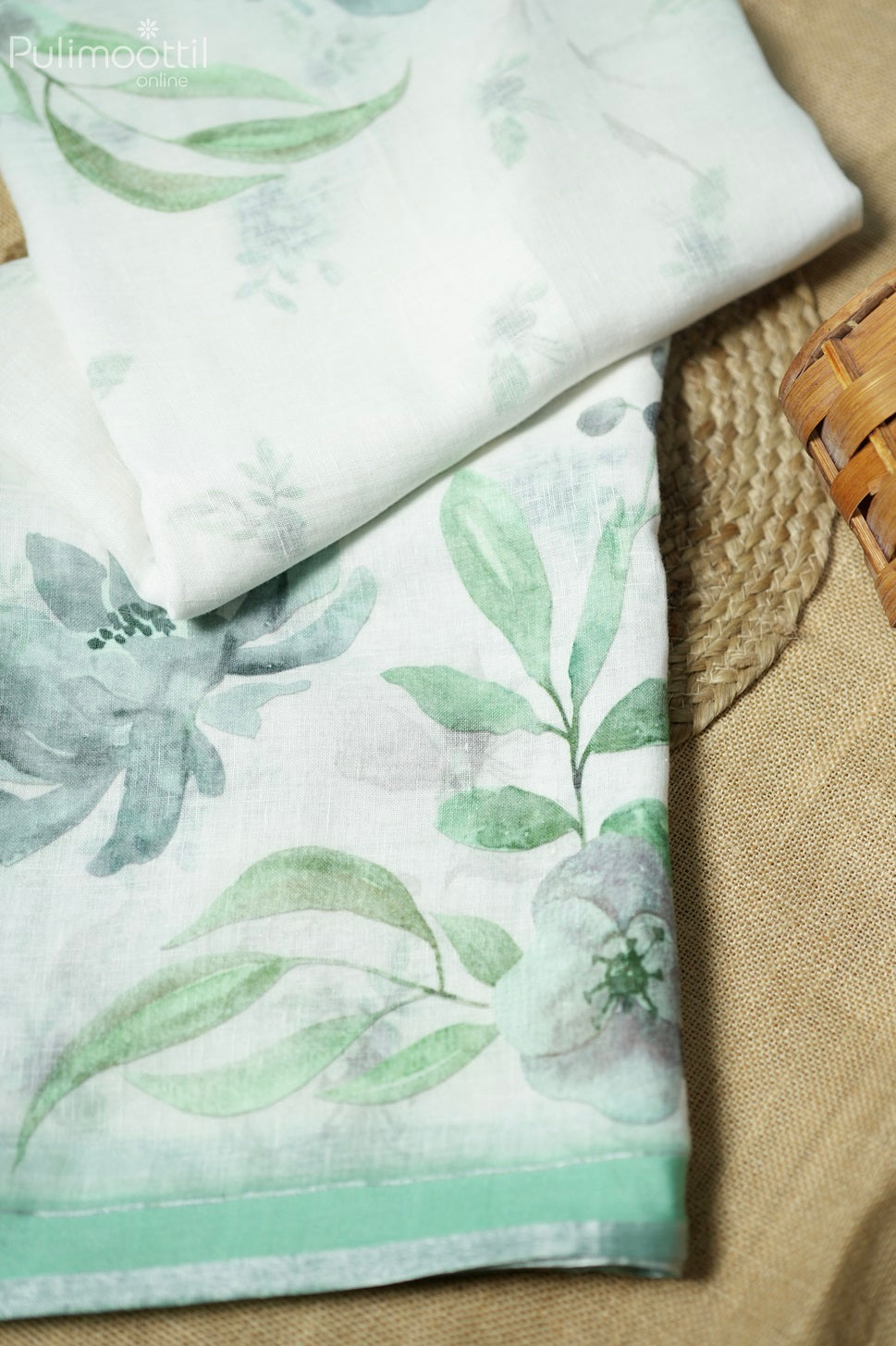 Off-white colored printed linen saree