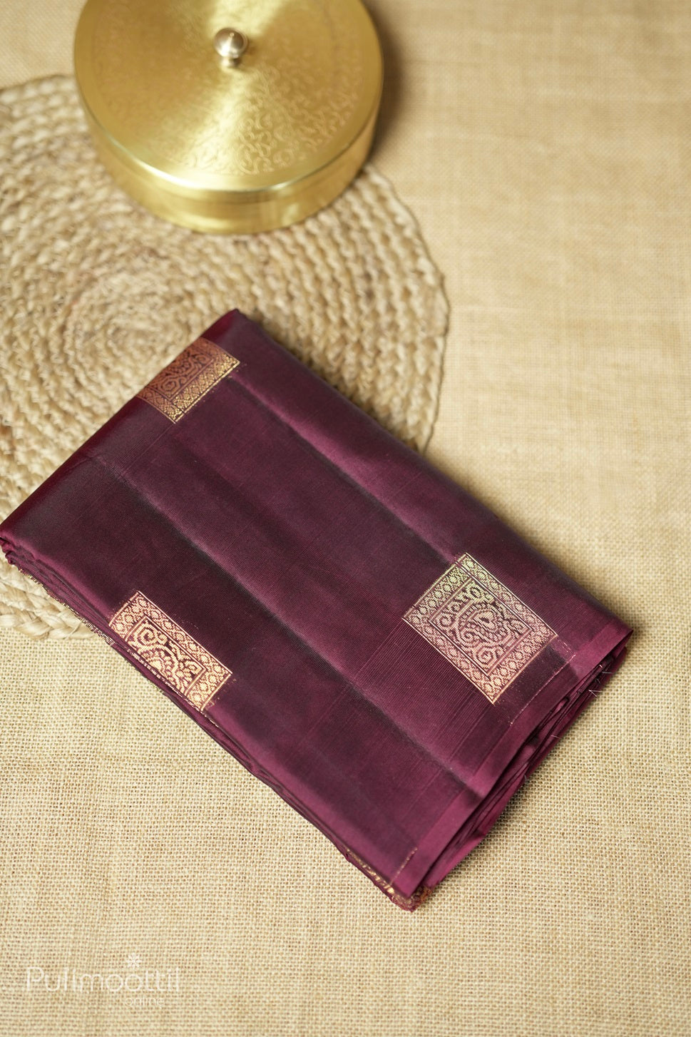 Dark maroon-colored Kanchipuram saree